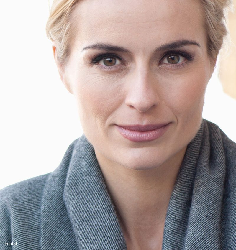 Close up headshot of a smiling woman