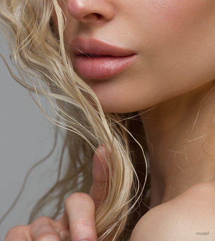 Lower face of a woman's full lips