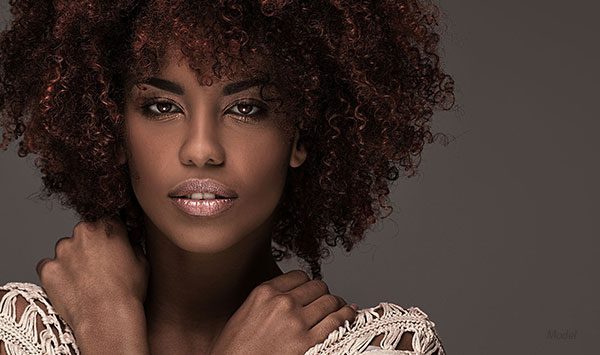 headshot of female model in a lace blouse