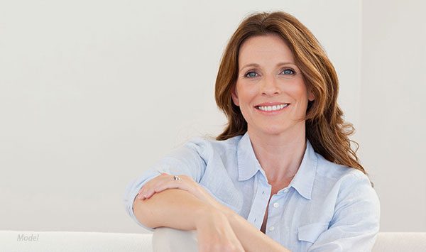 Middle aged female model on a couch