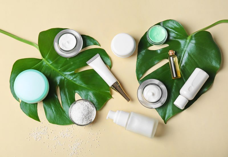 Skin care products on leaves.