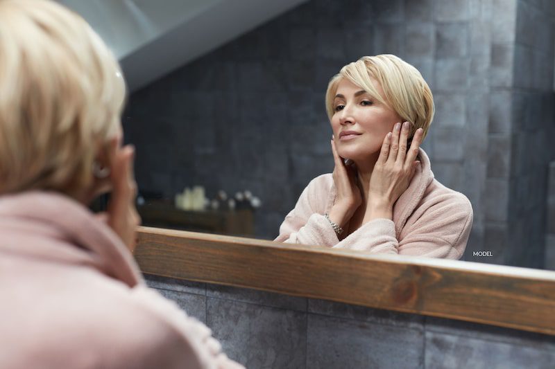 Mature woman after facial beauty treatment.