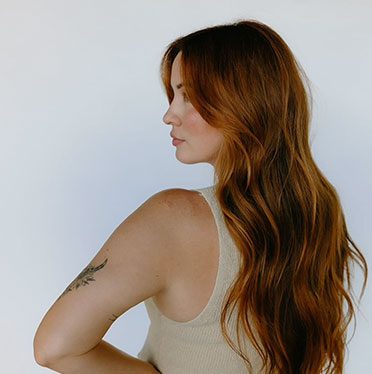 Woman with long hair turning to the left side